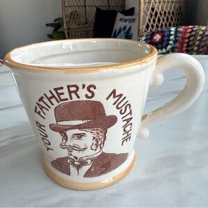 Vintage “Your Father's Mustache" ceramic mustache guard mug.